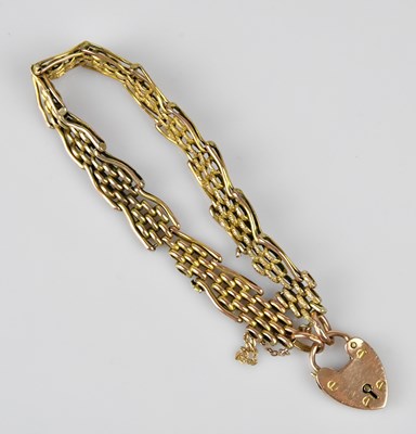 Lot 83 - A 9ct yellow gold gate link bracelet, with 9ct...