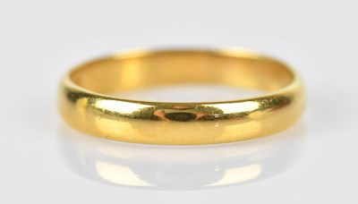 Lot 459 - A 22ct yellow gold wedding band, size N,...