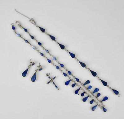 Lot 629 - A white metal and lapis lazuli five piece...
