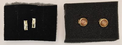Lot 1375 - Two pairs of 9ct gold stud earrings,...