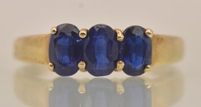 Lot 1292 - A 9ct yellow gold dress ring set with three...