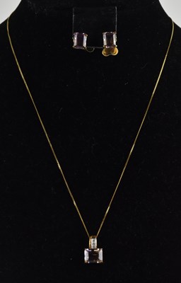 Lot 1343 - A claw set ametrine in a 9ct gold pendant...