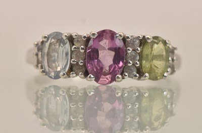 Lot 1288 - A 9ct white gold dress ring set with fancy...