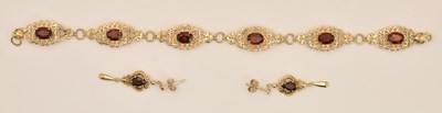 Lot 1439 - A 9ct yellow gold Middle Eastern style garnet...