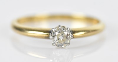 Lot 492 - An 18ct yellow gold diamond set ring, the oval...