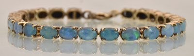 Lot 1442 - A gold on silver line bracelet containing...