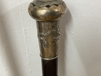 Lot 15 - Two bamboo style walking sticks, one with...