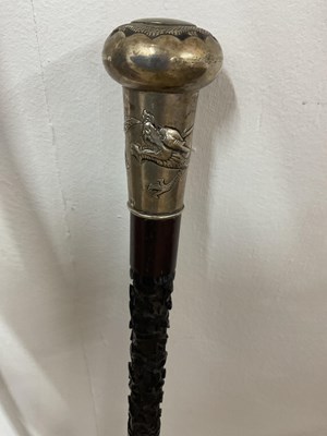 Lot 15 - Two bamboo style walking sticks, one with...