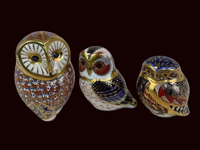 Lot 195 - ROYAL CROWN DERBY; three owl paperweights,...