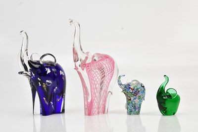 Lot 1231 - Four contemporary glass elephants, each with...