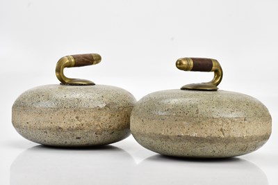 Lot 1439 - A pair of curling stones (2).