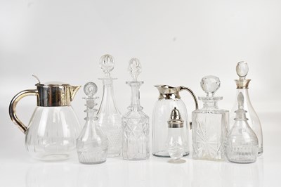 Lot 1232 - A collection of cut glass decanters, including...