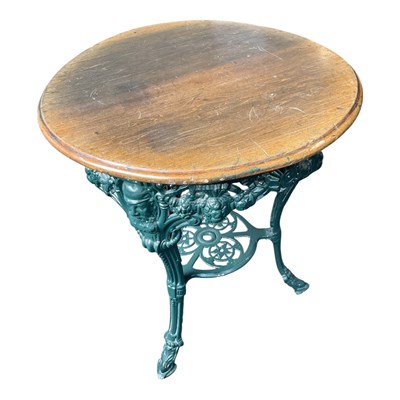 Lot 167 - A green painted cast iron W G Grace pub table,...