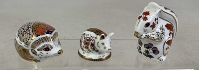 Lot 219 - ROYAL CROWN DERBY; three animal paperweights,...