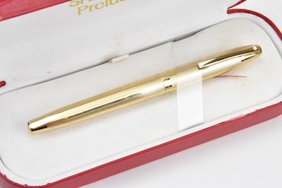 Lot 2115 - SHEAFFER; a gold plated Prelude fountain pen,...