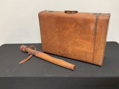 Lot 394 - A leather suitcase and a sword case