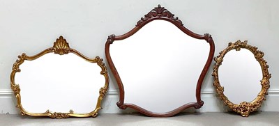 Lot 1017 - Two decorative gilt wall mirrors (one upside...