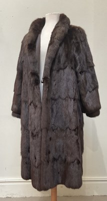 Lot 1318 - A vintage knee length brown mink coat, fully...