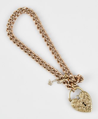 Lot 104 - A 9ct yellow gold flat link bracelet, with 9ct...
