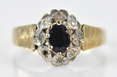 Lot 575 - A 9ct yellow gold illusion set cluster ring...
