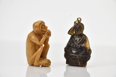 Lot 1656 - A carved figure of seated Buddha, together...