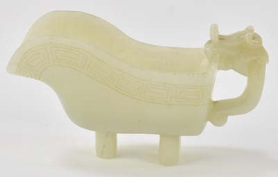 Lot 1001 - A Chinese celadon jade archaistic pouring...
