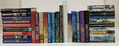 Lot 351 - TERRY PRATCHETT; a collection of thirty-six...