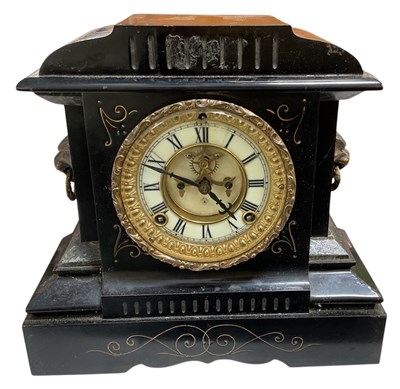 Lot 173 - A late Victorian black slate mantel clock, the...