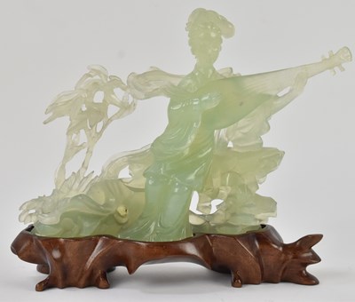 Lot 1033 - An early 20th century Chinese carved green...