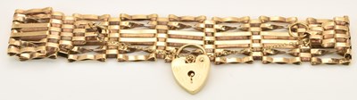Lot 1424 - A 9ct yellow gold gate link bracelet, with...