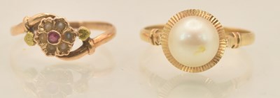 Lot 1270 - A yellow metal ruby and seed pearl set flower...