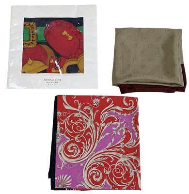 Lot 474 - VERSACE; a boxed silk scarf, a Dior silk scarf...