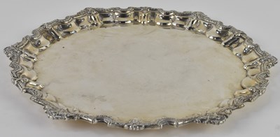 Lot 1092 - An Arabic white metal salver, with frilled...