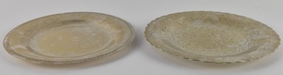 Lot 1093 - Two circular Arabic white metal plates, one...