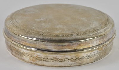 Lot 1094 - An Arabic white metal circular lidded box,...