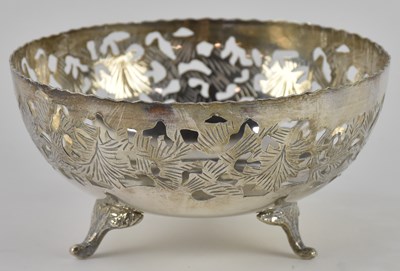 Lot 1152 - An Arabic white metal circular pierced footed...