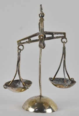 Lot 1172 - A pair of miniature Arabic white metal scratch...