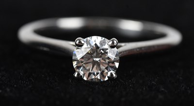 Lot 369 - CARTIER; a platinum diamond solitaire ring,...