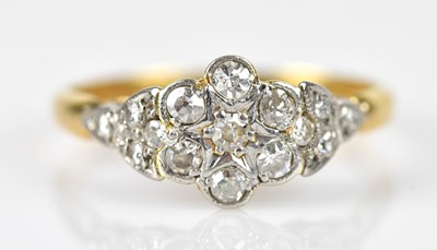 Lot 497 - An 18ct yellow gold and platinum daisy cluster...