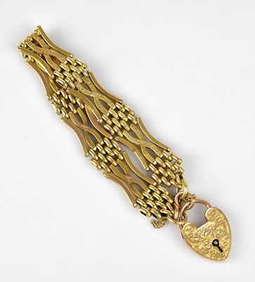 Lot 95 - A 9ct yellow gold gate link bracelet, with 9ct...