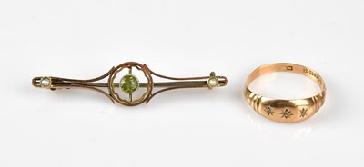 Lot 594 - A 9ct yellow gold dress ring set with three...
