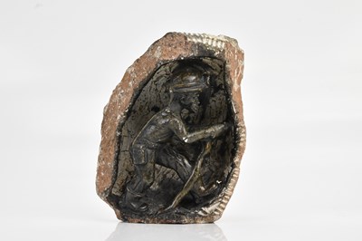 Lot 616 - A South African stone carving of a miner,...