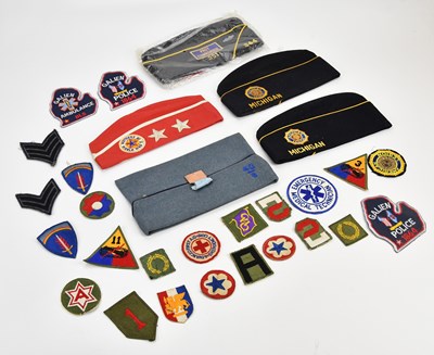 Lot 526 - A collection of US Army patches and caps.