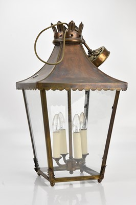 Lot 578 - A reproduction brass and copper street style...