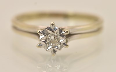 Lot 1242 - An 18ct white gold diamond solitaire ring, the...