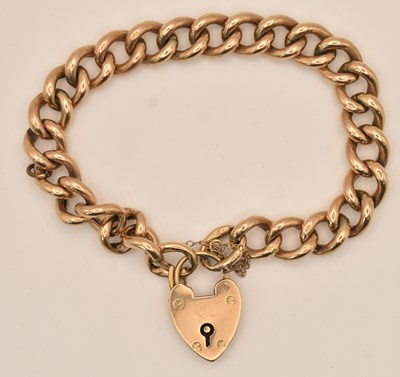 Lot 1413 - A 9ct yellow gold flat curb link bracelet,...