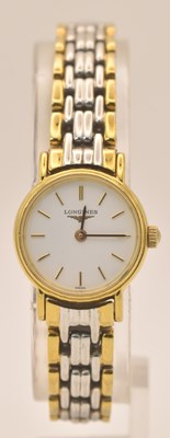 Lot 1540 - LONGINES; a lady's gold plated stainless steel...