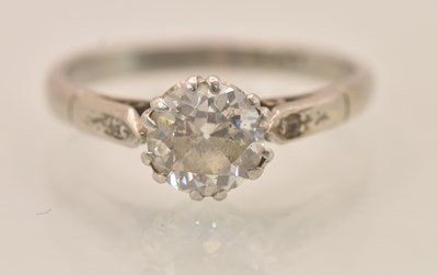 Lot 1201 - A platinum diamond solitaire ring, the central...