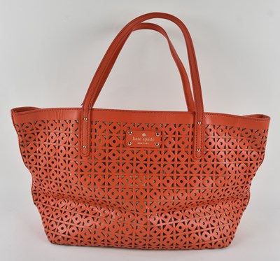 Lot 444 - KATE SPADE; an orange geometric cut-out mesh...