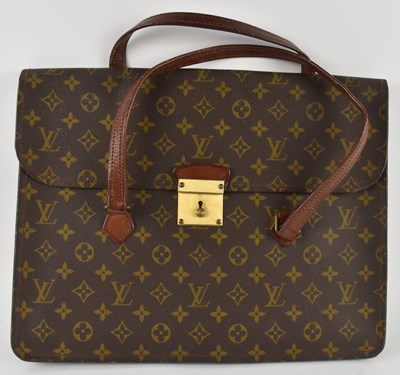 Lot 457 - LOUIS VUITTON; a vintage brown leather...